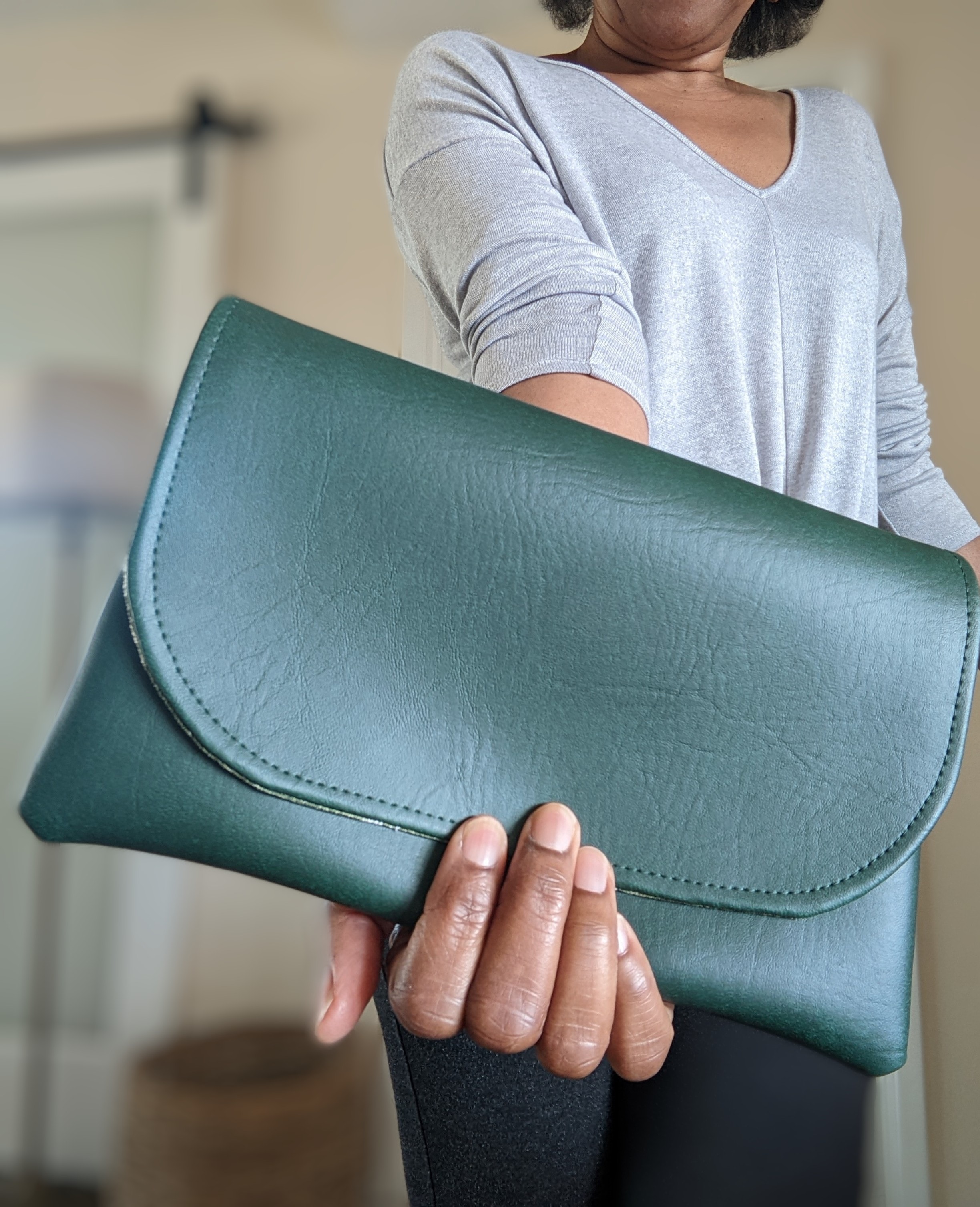 Handmade faux leather clutch by SanjBDesigns.