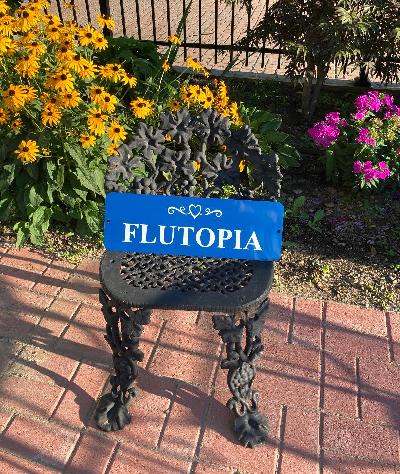 The Flutopia sign is a  stunning royal blue with heart and swirl design and just one word from a friend to me "Flutopia".  It is made of aluminum with vinyl letterings for indoor or outdoors.Great for a teaching studio, dorm room, or hung in a space everyone will view.