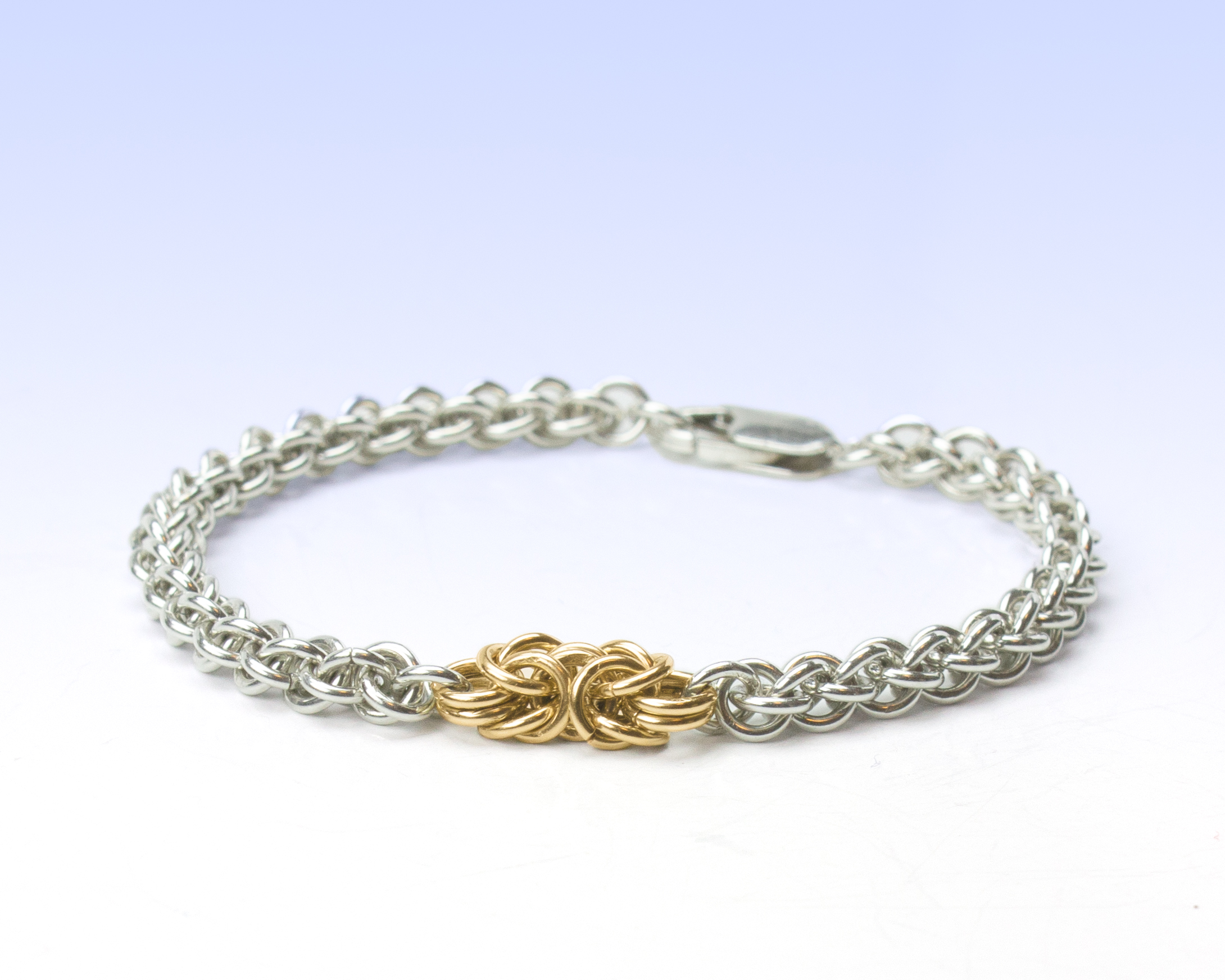 Silver chain bracelet with gold fill accent knot