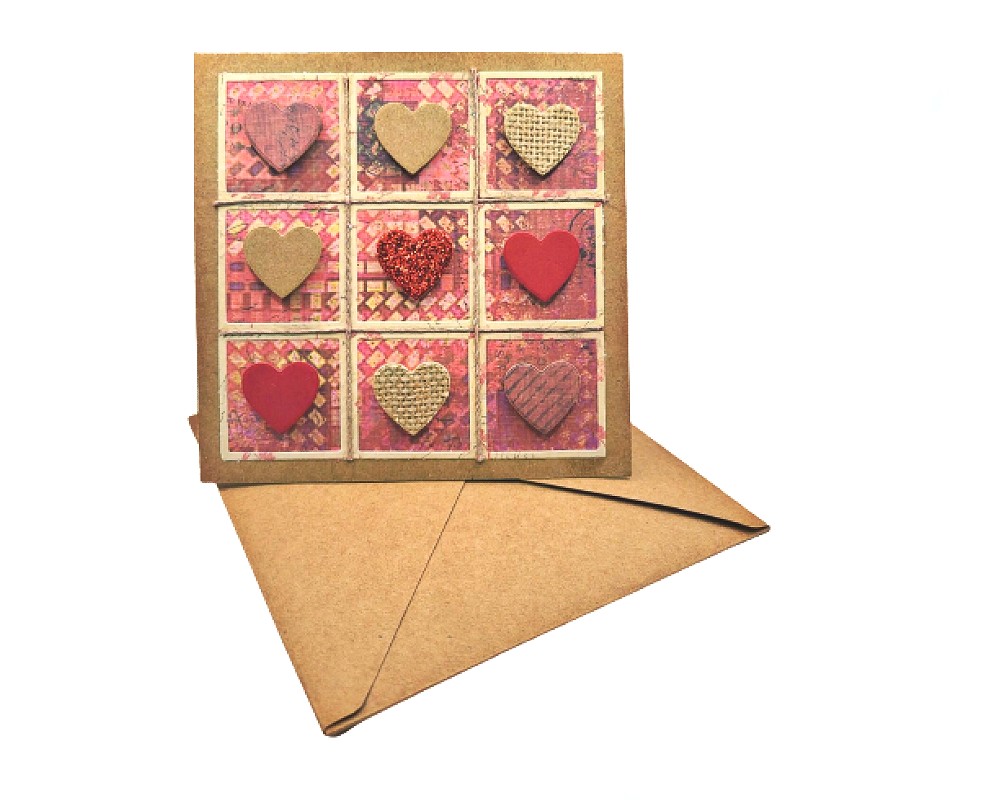 Say "I Love You" in the most special way with our Handmade Heart Greeting Card. Made with premium quality kraft paper, this unique greeting card is designed with a rustic and earthy feel, making it a perfect choice for those who prefer something different from the standard store-bought cards.

The front of the card is adorned with paper and burlap hearts, arranged in a charming pattern that will bring a smile to anyone's face. Whether you want to express love, gratitude, or send a friendly greeting, this Handmade Heart Greeting Card is the perfect way to do so.

The interior of the card is left blank, providing plenty of space for you to write a personal message that will be treasured for years to come. Each card is crafted with love and care, ensuring that your special message will be cherished. Order now and surprise your eloved ones with a unique, one-of-a-kind handmade greeting card that truly captures the essence of your love.

Card is 5 x 5 inches and comes with a handmade kraft paper envelope.