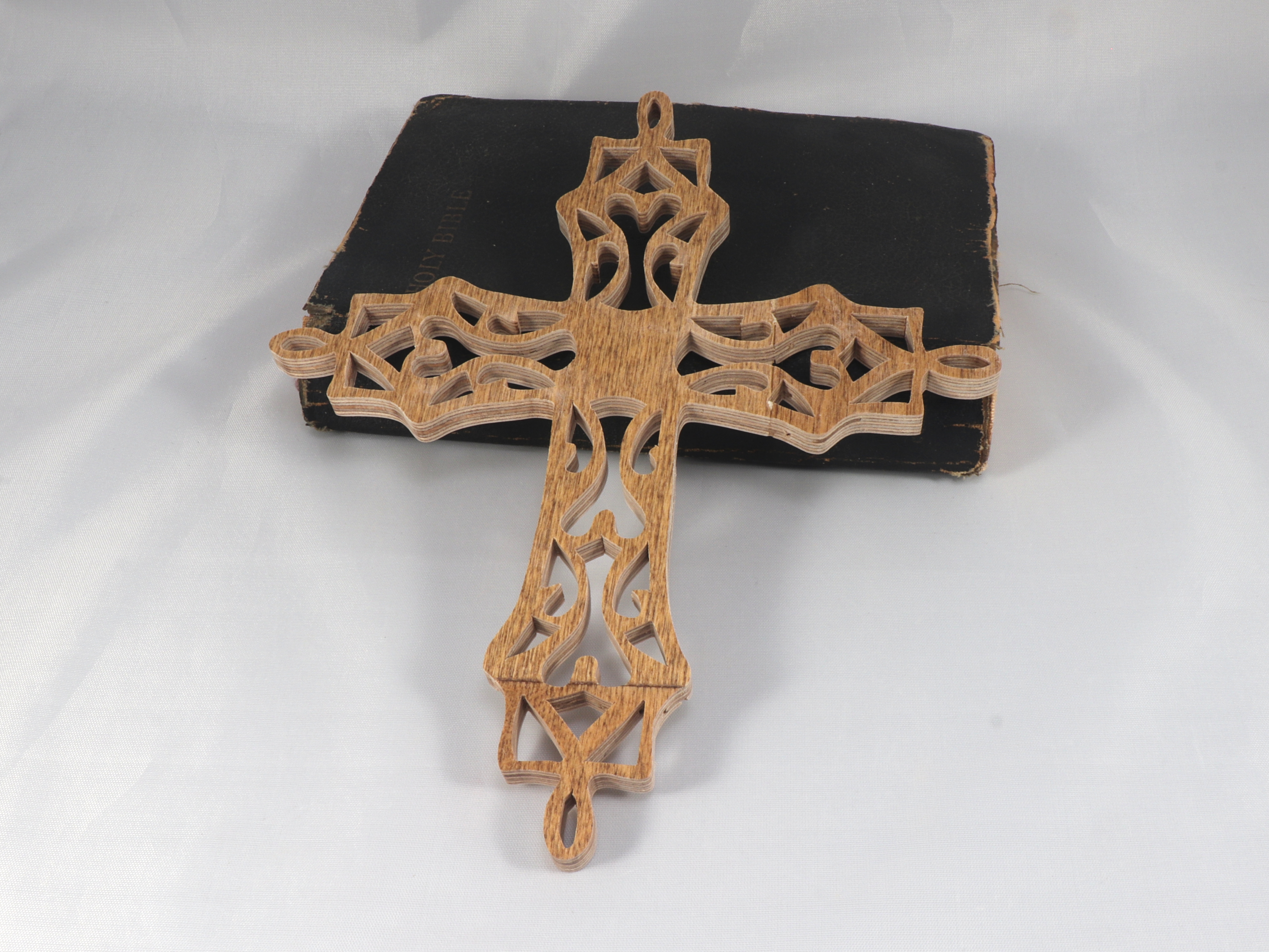 Beautiful handmade rustic fretwork cross made from recycled materials. Intricate fretwork design adds eye-catching detail to any room.