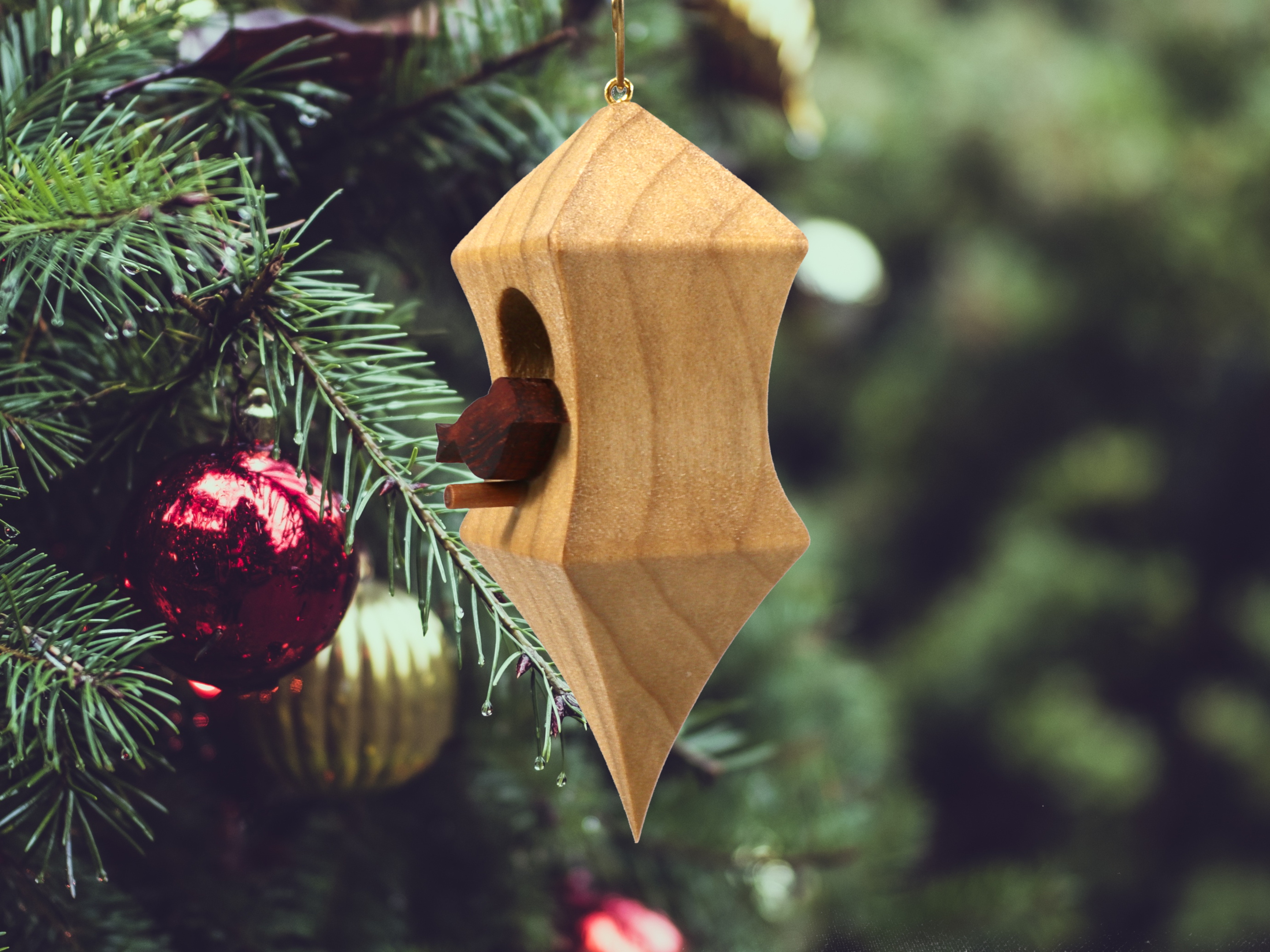 Handmade Wood Birdhouse Ornament Collectable Christmas Tree Ornament shapeed like a Christmas tree. Made from select-grade hardwoods, hand-sanded, and finished with a custom blend of oils and waxes using traditional woodworking tools.