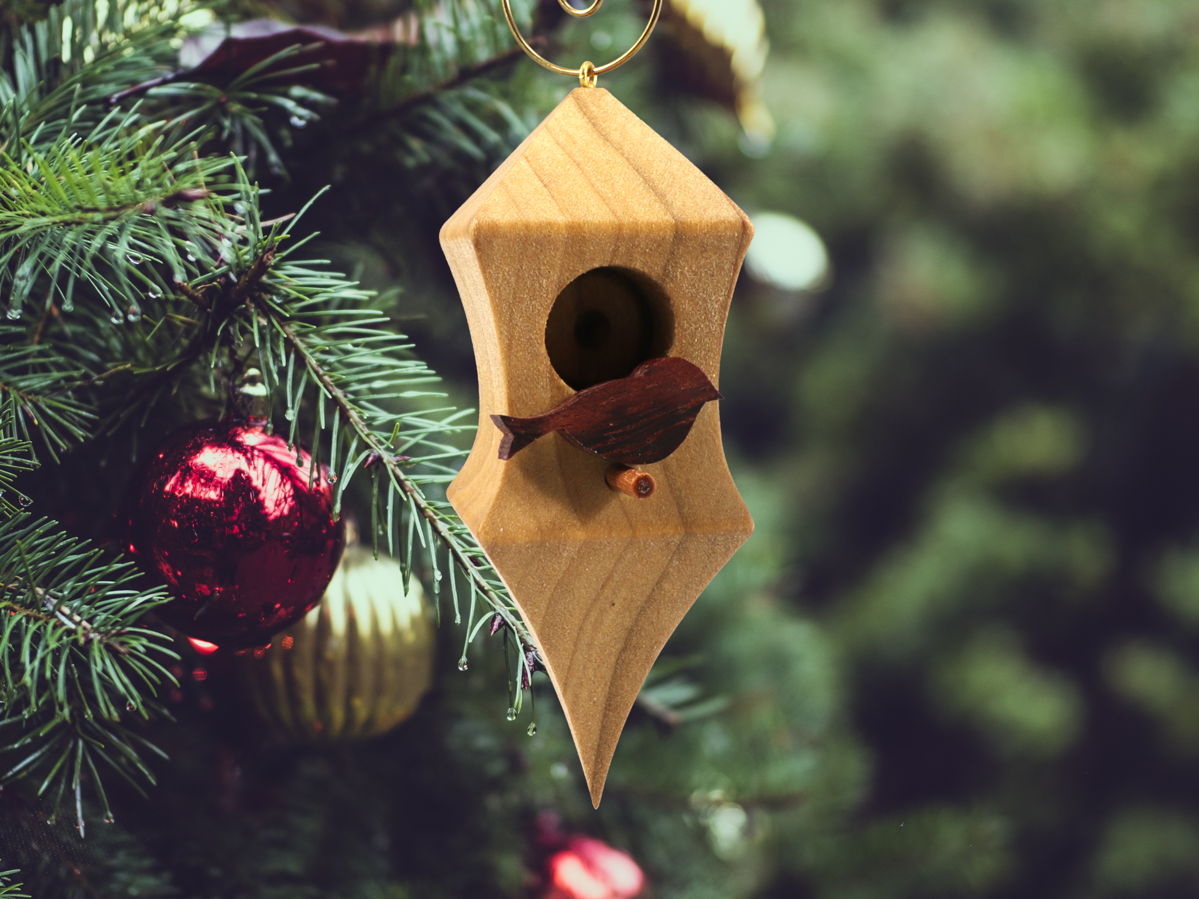 Handmade Wood Birdhouse Ornament Collectable Christmas Tree Ornament shapeed like a Christmas tree. Made from select-grade hardwoods, hand-sanded, and finished with a custom blend of oils and waxes using traditional woodworking tools.