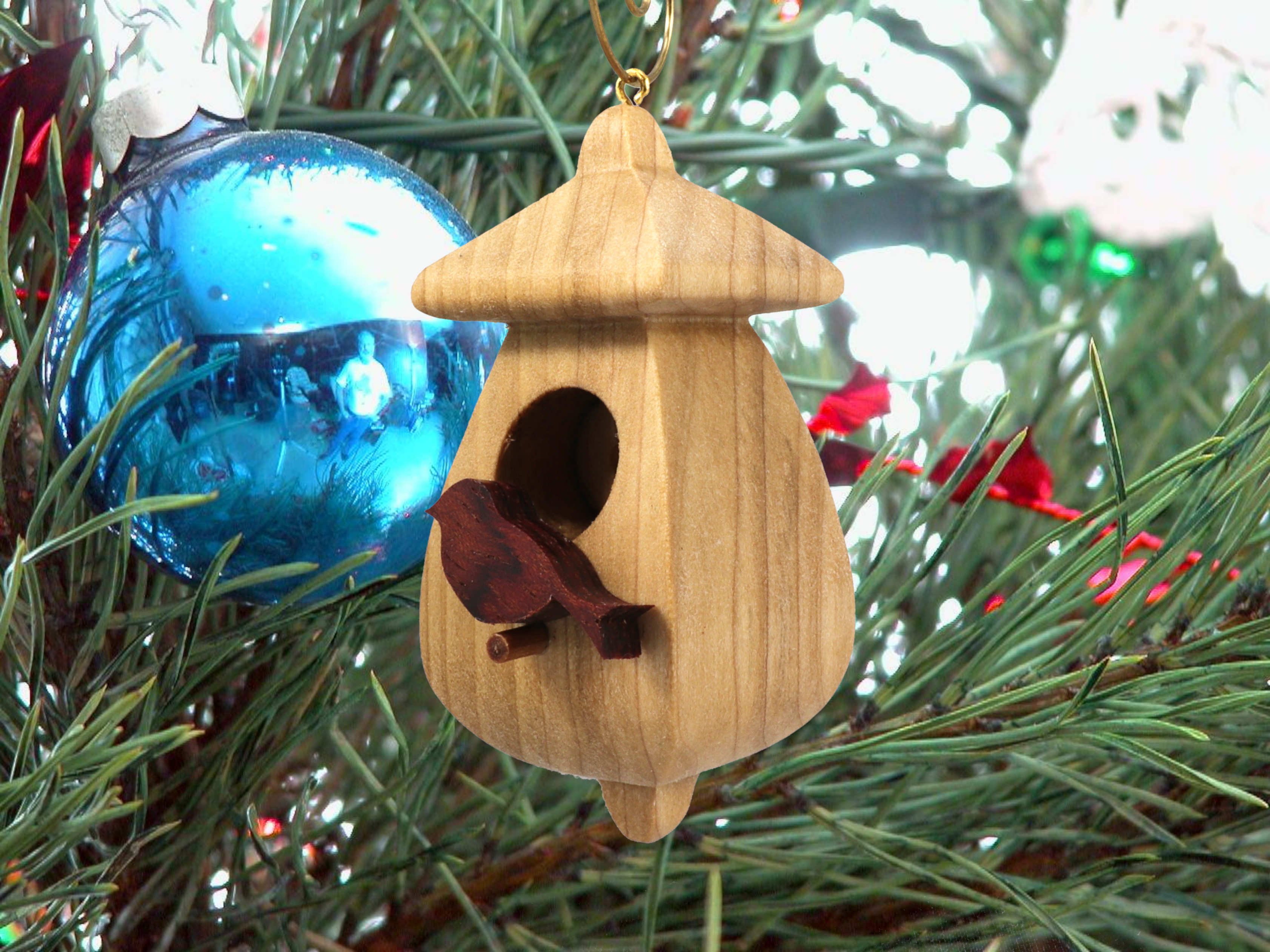 Handmade Wood Birdhouse Ornament Collectable Christmas Tree Ornament shapeed like a Christmas tree. Made from select-grade hardwoods, hand-sanded, and finished with a custom blend of oils and waxes using traditional woodworking tools.