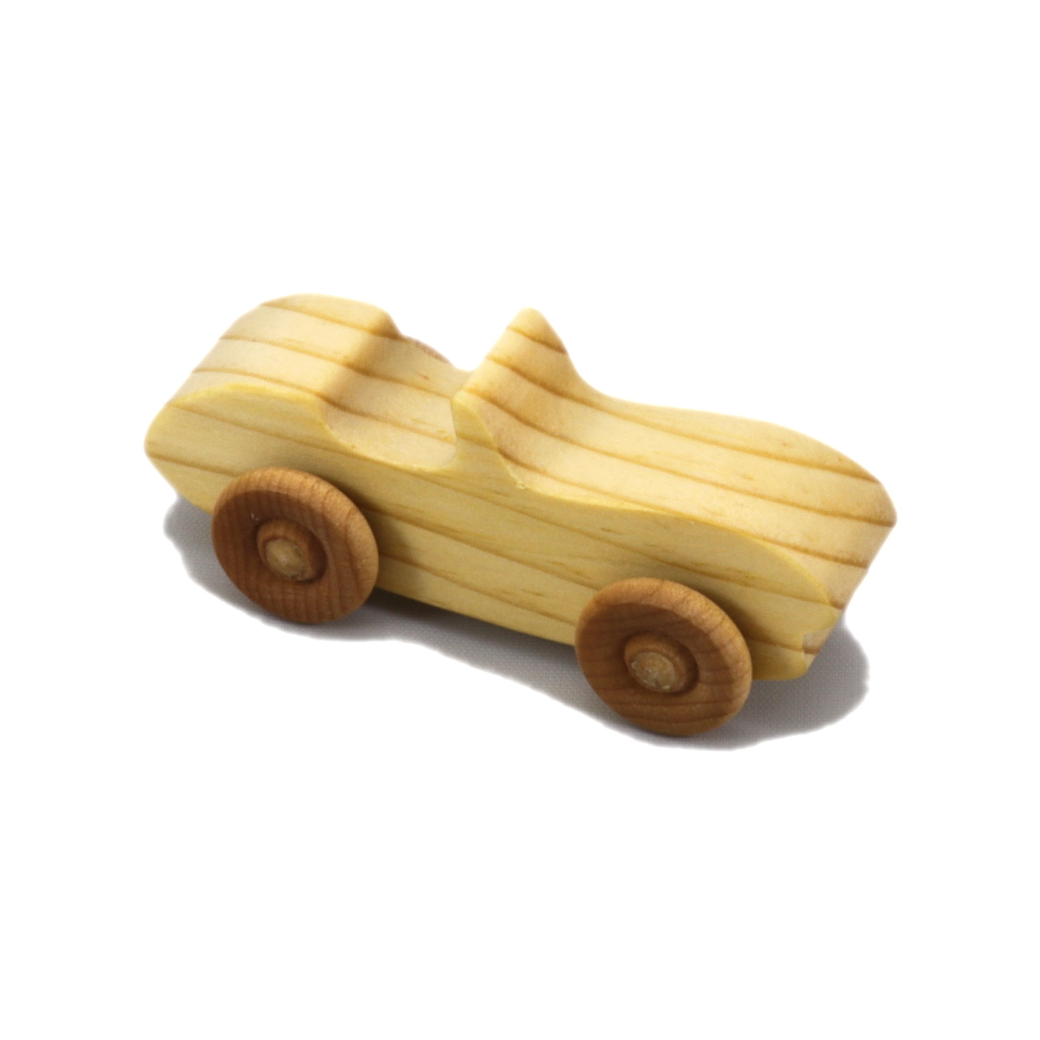 A small handmade wooden toy car hand-finished with a custom blend of mineral oil and waxes.