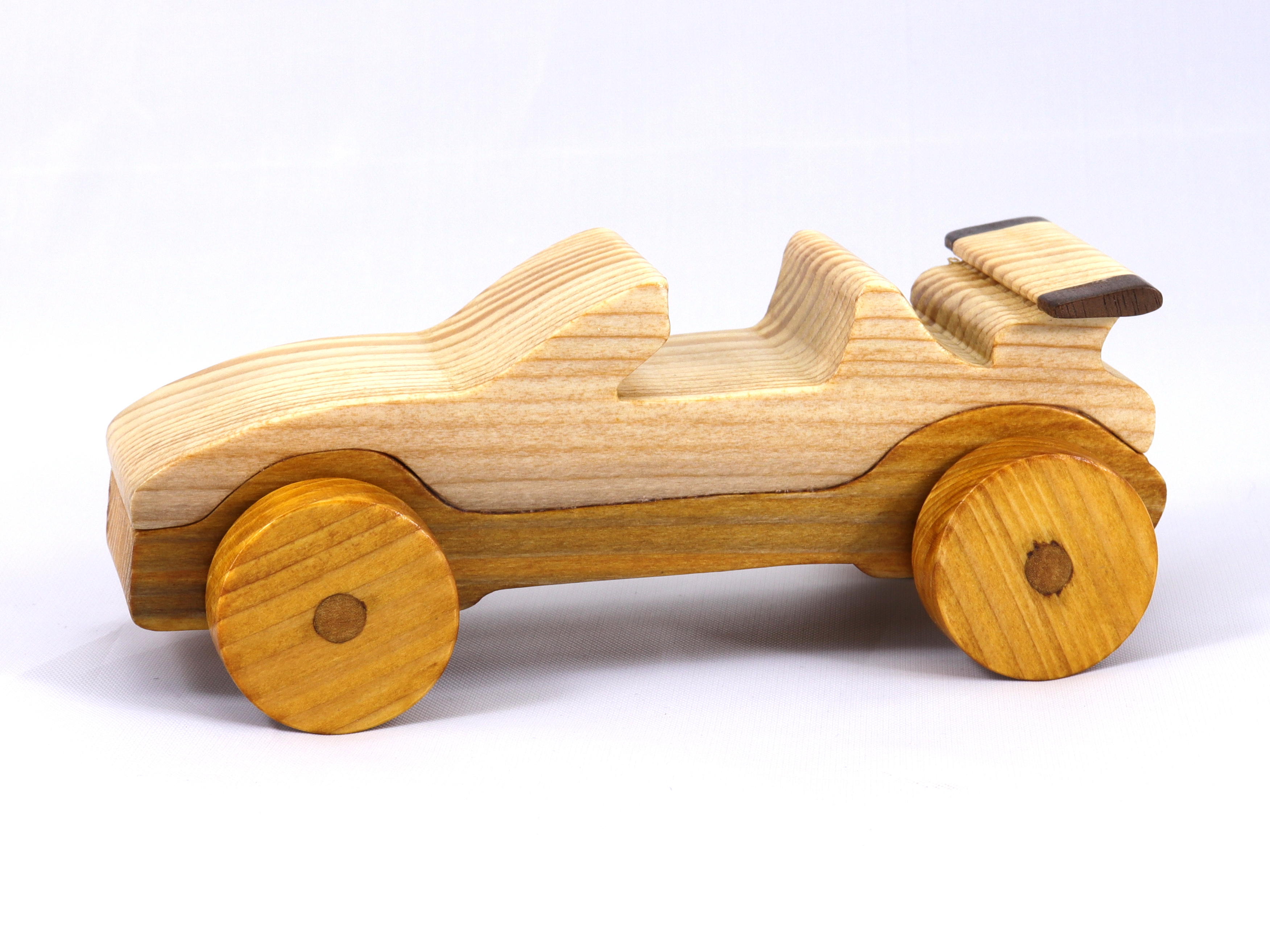 Handmade wooden toy car convertible finished with two-tone clear and amber shellac, one of ten cars in my Speedy Wheels Collection.