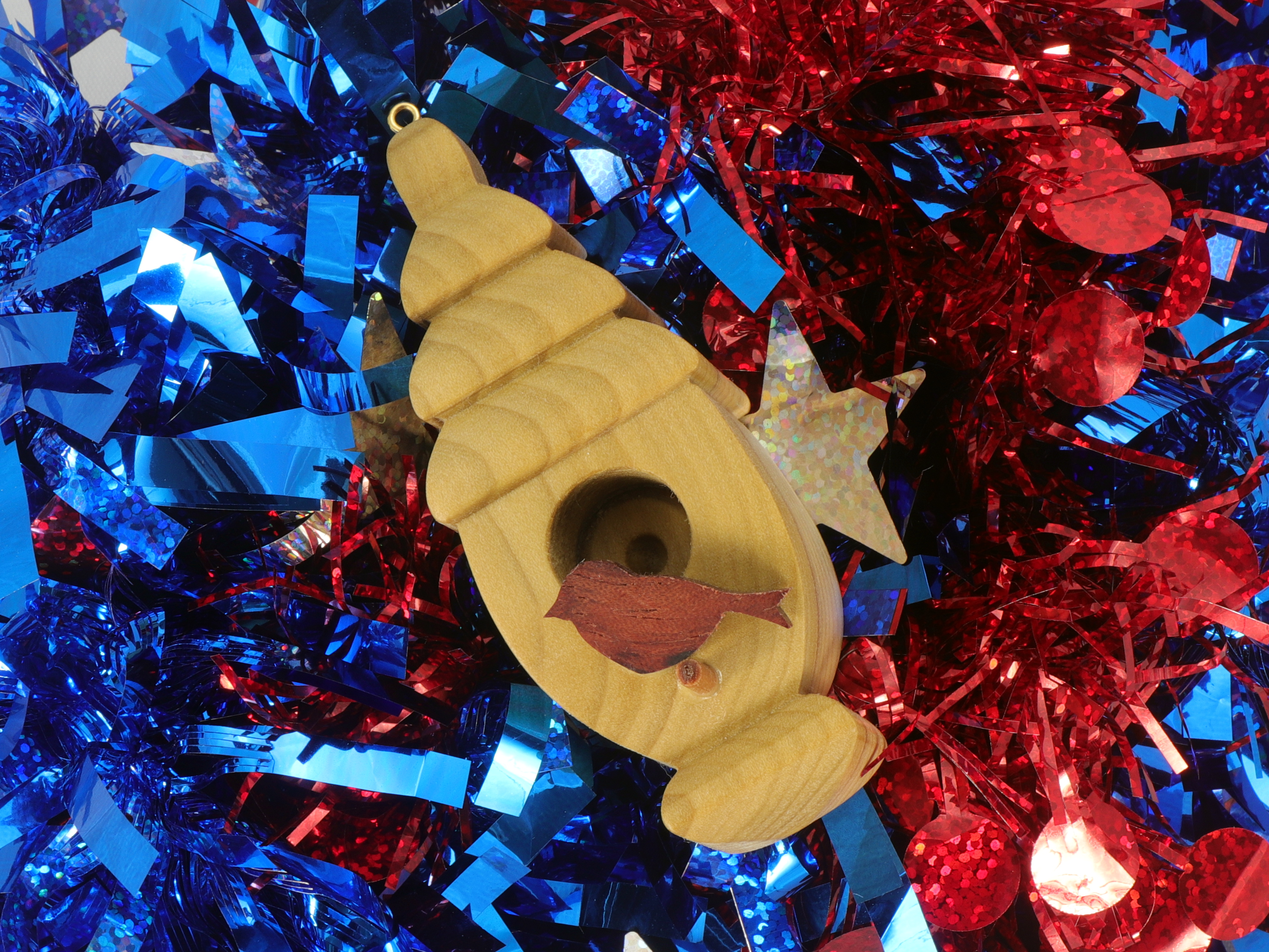Handmade Wood Birdhouse Ornament Collectable Christmas Tree Ornament shapeed like a Christmas tree. Made from select-grade hardwoods, hand-sanded, and finished with a custom blend of oils and waxes using traditional woodworking tools.