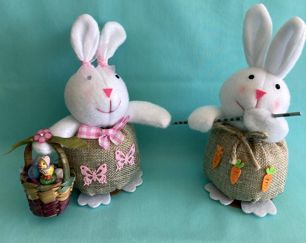 Adorable Easter bunnies the girl carryies a little  basket with eggs and flowers.and the male is playing a flute. These are hand crafted and we made sure to put a small round disc under their feet to keep them from fallins. These other pics show side, back, ears, clothing and add ons we have done.  ENJOY!