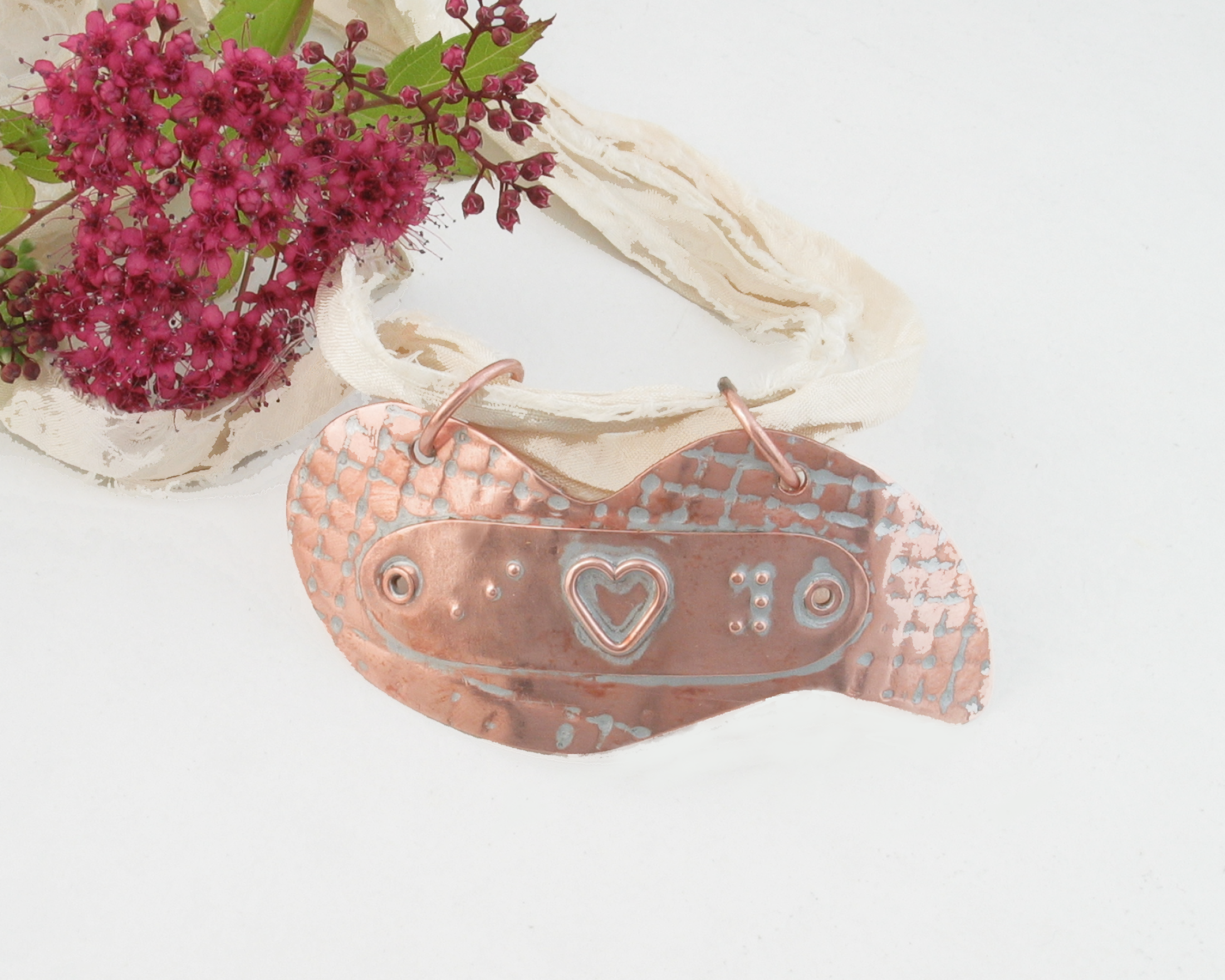 Copper Braille Pendant Medallion Necklace that says I Love You with a tactile heart for the word love.