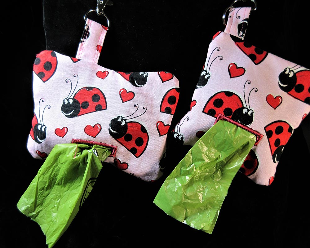 dog poop bag holder bone shape red lady bugs and pink hearts