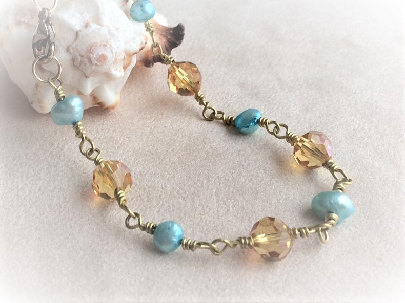 Wire wrapped bracelet topaz and aqua beads