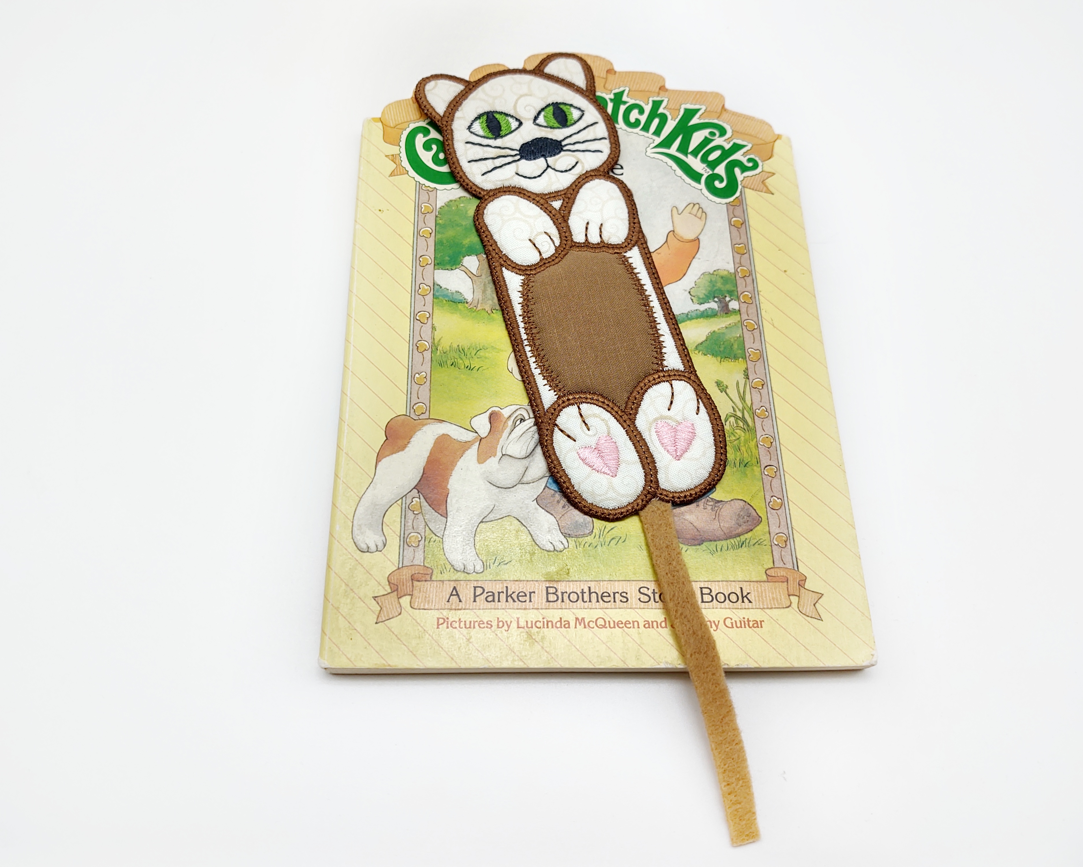 These cute animal bookmarks would light up the eyes of any child that is a reader.  They will keep their page marked and are large enough to easily find in their book.  There is a rabbit, pig, duck, dog, cat, mouse, horse, bear, elephant, and an owl.  I will be listing them in this order so you know which one is which. Listing is for one bookmark.  Last picture shows all the bookmarks available.

    What you get:  Your choice of one bookmark done in machine embroidery.

    Fabric colors:  Cheerful colors of yellow, pink, white, tan, gray, and brown.  Reverse is the same color as the front.

    Fabrics Used:  Two layers of 100% cotton fabric, a layer of batting.  Fabrics have been preshrunk.  All finished with colorful polyester machine embroidery thread.

    Size:  Pig, Rabbit and Duck measure 3 inches by 6 1/2 inches.  The other seven bookmarks measure 2 inches by 6 1/2 inches

    Care: Hand - machine-wash in warm or cold water with like colors.  Lay flat to dry.  Do not use bleach.

NOTE:  These are done with a wash away stabilizer.  If you wash by hand let them soak for at least 15 minutes in warm water to rinse all the stabilizer out of the bookmark.  Book is not included with this listing, for display purposes only.