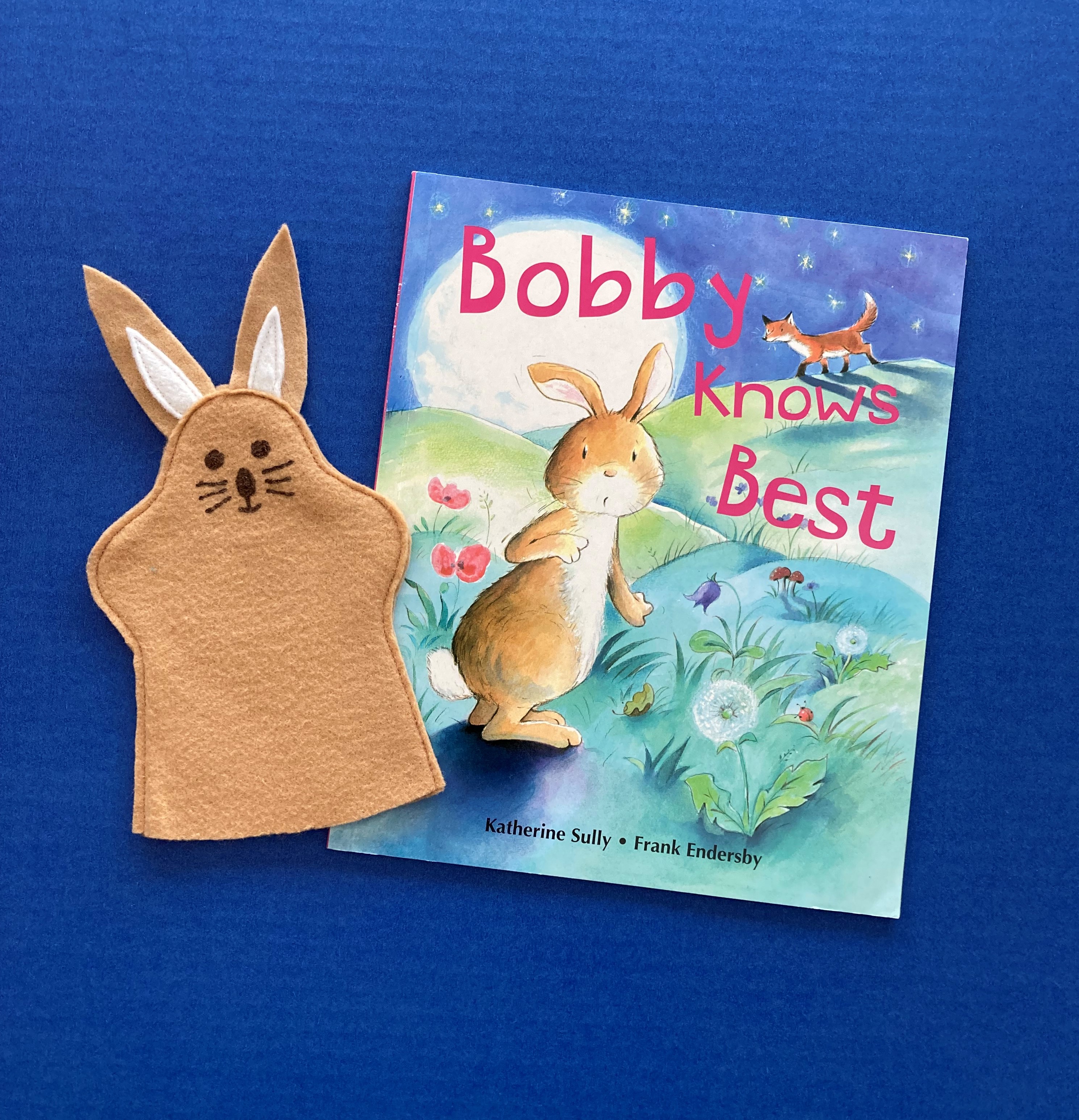 Tan rabbit felt puppet for toddlers with matching book Bobby Knows Best