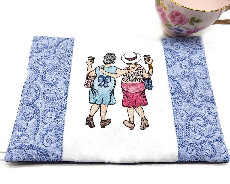 This fabric mug rug coaster will give you a laugh, but it is so true.  Best friends having coffee and walking.  Great for protecting your table and giving your kitchen a little colorful, cheery atmosphere.  Great for holding your coffee or tea and a little snack.

    What you get:  One BFF mug rug fabric coaster, quilted and machine embroidered.  
    Fabric color:  A lovely light multi blue swirl ends, white embroidered center and a mottled royal blue back.  Colorful "old ladies." done in colors of blues and pinks with their coffee cups in hand.
    Two layers of 100% cotton fabric, lined with polyester batting-all preshrunk. A layer of stabilizer is also used so that it will hold it's shape.  The back opening has been seal shut with a sealing tape so that it is permanently steamed closed.  The "old ladies" are done in machine embroidery.

    Size: 8 inches x 6 inches, larger than a regular mug rug.
    Care:  Hand or machine wash in cold water with like colors, air dry.  No bleach.
    Listing is for one mug rug coaster.  Tea cup and ruler are not included, they're for display purposes only.