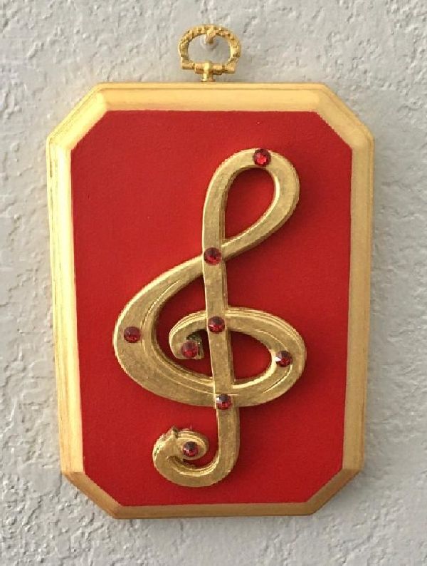 Out plaque with treble clef and crystals is completely handmade from beginning to the end.  Treble clef is attached to thick routed plaque and painted with 18k gold paint.  Crystals accent the clef and the 3D effect combines all avenues into one . Lovely for wall decor in any place it may be.
